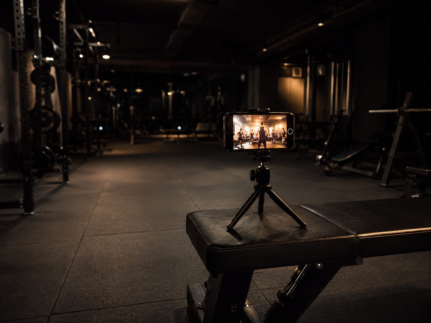 A class streaming live on a phone on the gym floor